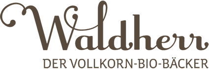 Das Waldherr-Logo in dunkelbraun. Geschwungener Schriftzug mit "der Vollkorn-Bio-Bäcker" in serifenloser Schrift darunten