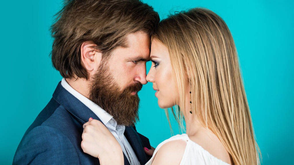 Liebe: Love language. valentines day for them. mature man with girlfriend. romantic relationship and dating. couple in love. sexy formal couple. bearded man and woman embrace. fashion and beauty.