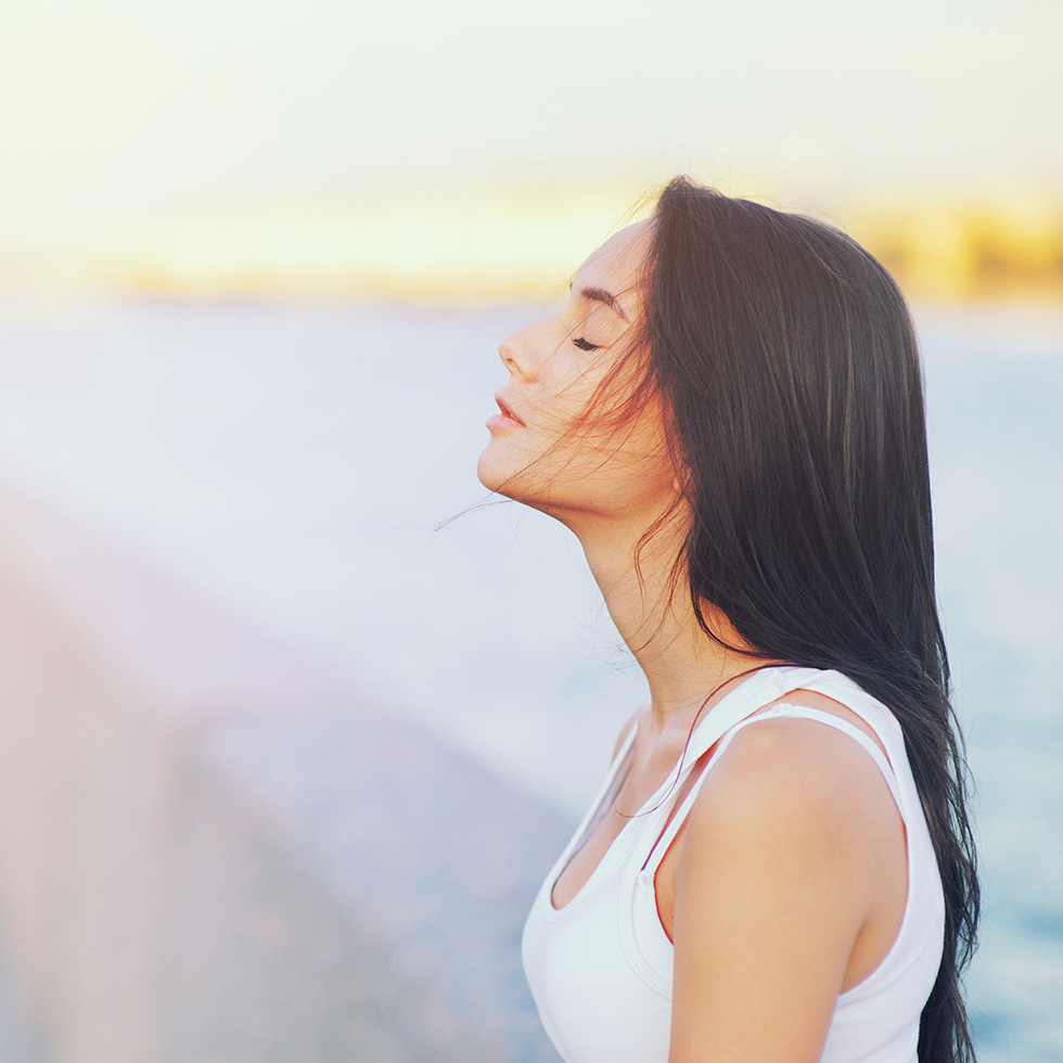Side view profile portrait of a happy brunette woman relaxing breathing fresh air outdoors in summer Girl closed eyes doing deep breath exercises. Positive emotion success, peace of mind, zen concept.