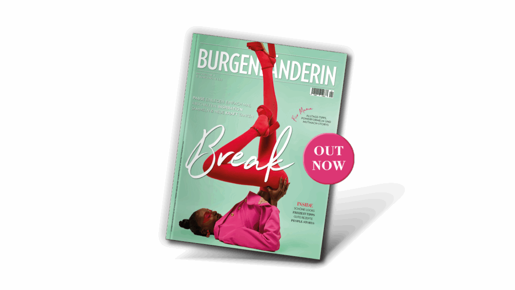 Mai-Ausgabe: Magazincover „Burgenländerin“ (Mai 2026): Frau in pinkem Outfit und roten Strumpfhosen liegt auf dem Rücken, Beine akrobatisch nach oben gestreckt; Titelthema „Break“ vor mintgrünem Hintergrund.