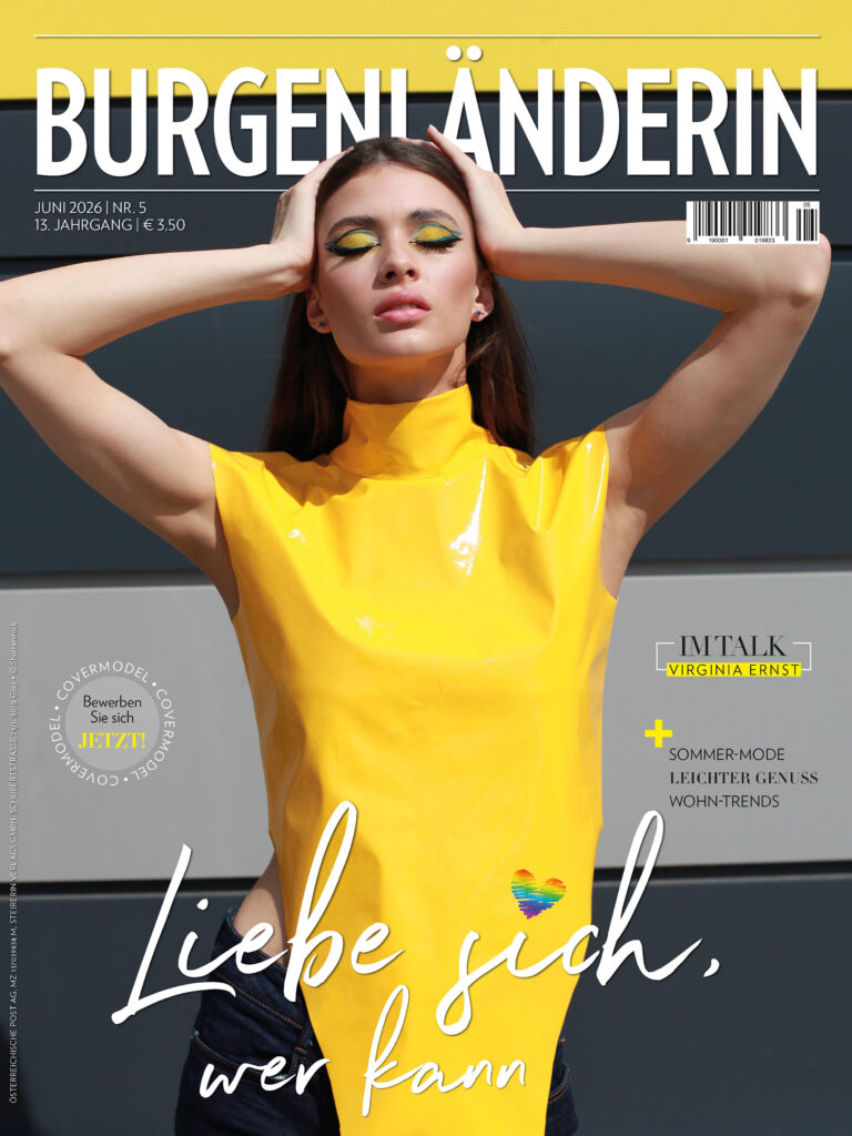 Magazincover der BURGENLÄNDERIN: Frau in glänzend gelbem Oberteil mit geschlossenen Augen und auffälligem gelb-blauem Augen-Make-up vor dunklem Hintergrund, Titelthema „Liebe dich, wer kann“.